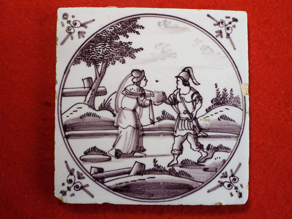 A rare `Bristol` manganese coloured `Delft` wall tile Ref.#CL-9
