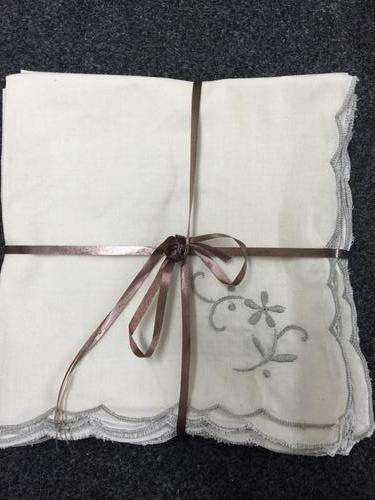 12 embroidered servietes