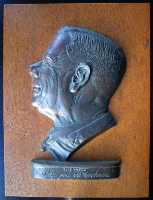 H.F. VERWOERD 1958-1966 "Skep jou eie toekoms" wood and metal plaque.