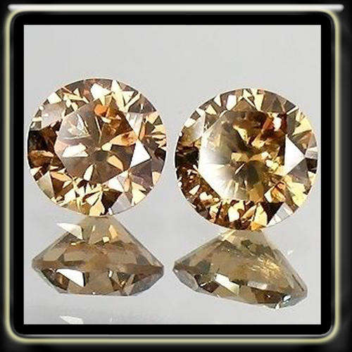 EXQUISITE 4.30CT A PAIR OF SPARKLING CHAMPAGNEPRECISION BRILLIANT ROUND DIAMOND SIMULANTS (7MM)