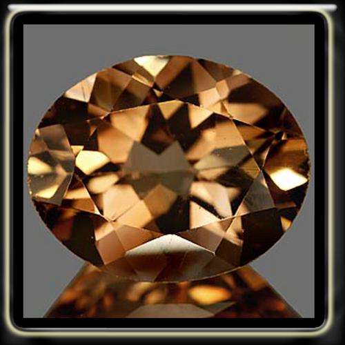 MAGICAL 1.52CT NATURAL IMPERIAL SHERRY TOPAZ, A POLISHED UNHEATED OVAL GEMSTONE