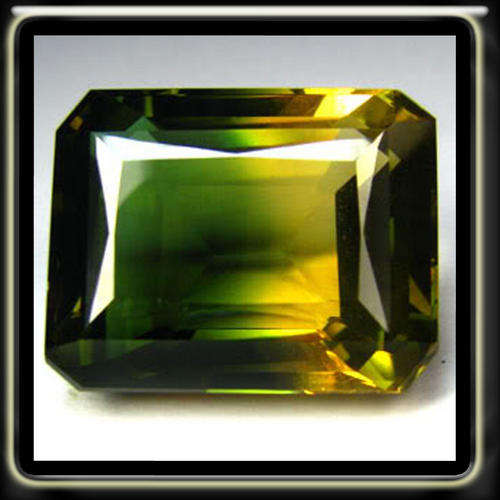 ASTONISHING 24.22CT NATURAL BI - COLOUR QUARTZ CUT IN A EMERALD POSHED GEMSTONE