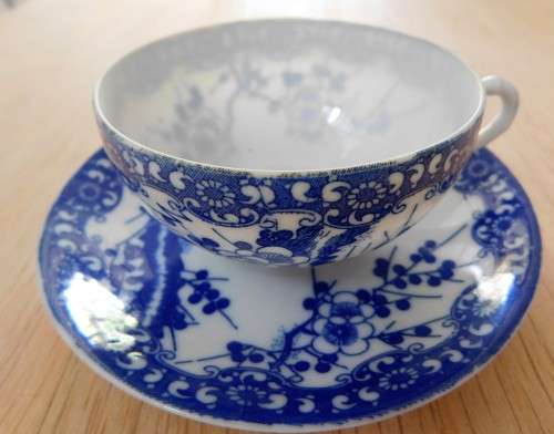 Oriental blue and white eggshell cup and saucer