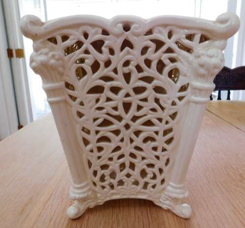 Pretty cream footed ornate vase with insert