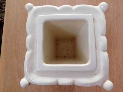 Pretty cream footed ornate vase with insert