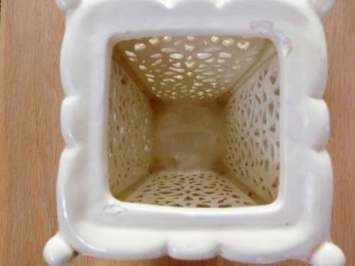 Pretty cream footed ornate vase with insert