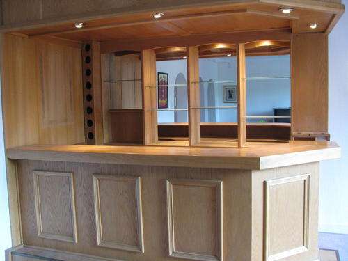 Built-in bar with lights, mirror panel and solid oak counter