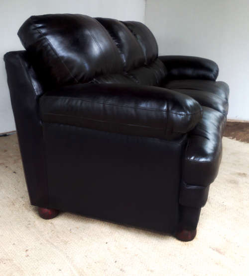 A MUST HAVE - Black Leather Couch