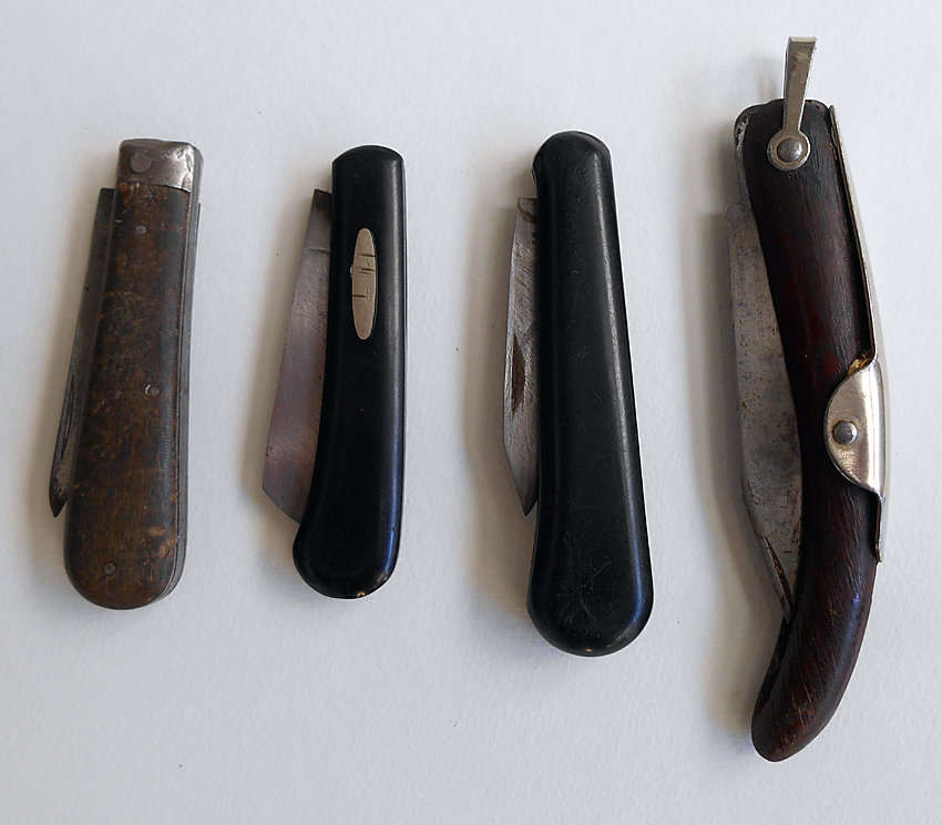 A lot of four well used vintage pocket knives