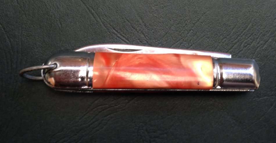 Pocket knife, crossed arrows mark.