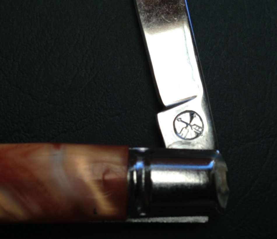Pocket knife, crossed arrows mark.