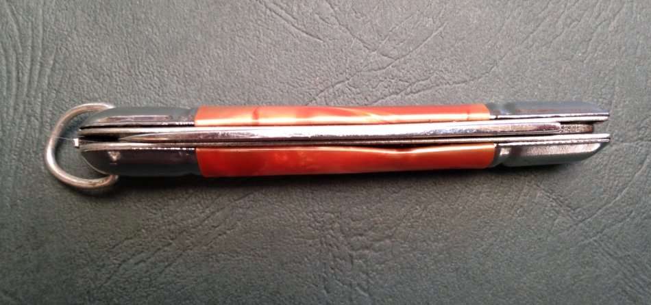 Pocket knife, crossed arrows mark.