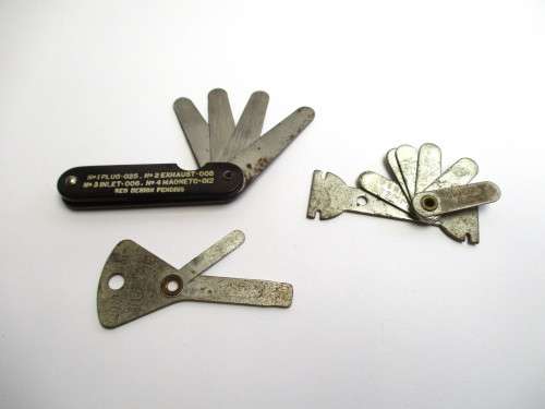 Lot -- Automobile / Car related items - Volvo badge / Milano badge / feeler guages and key chains.