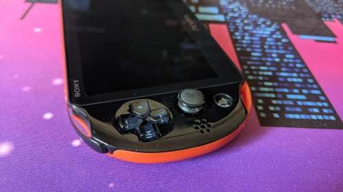 PS Vita Slim (2000) Red and Black with 3 games, 8GB Vita Memory card