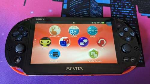 PS Vita Slim (2000) Red and Black with 3 games, 8GB Vita Memory card
