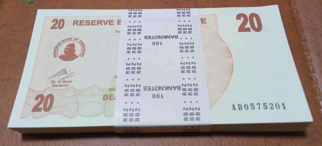 2006 Zimbabwe stack 100x Twenty Dollars bills in RBZ seal. Crisp UNC