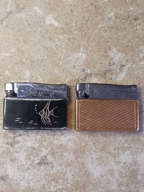 2 x vintage sunflower lighters (good condition)