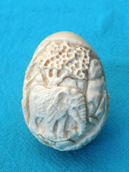 vintage ivory carved egg  with elephant