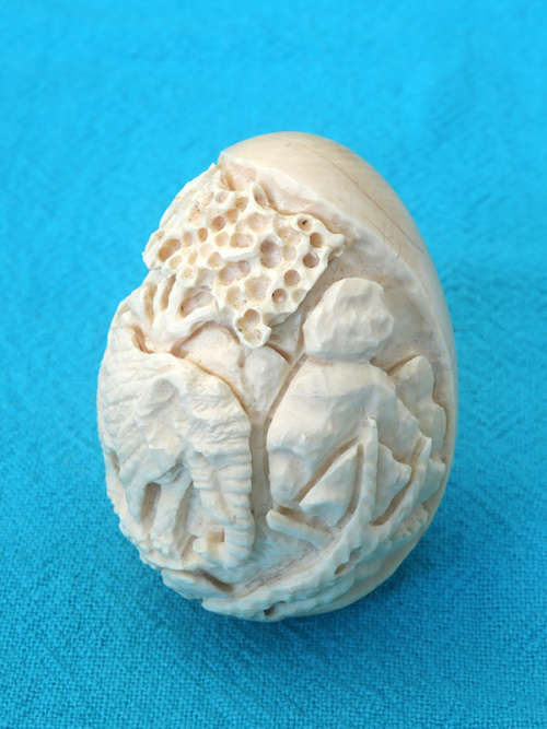 vintage ivory carved egg  with elephant