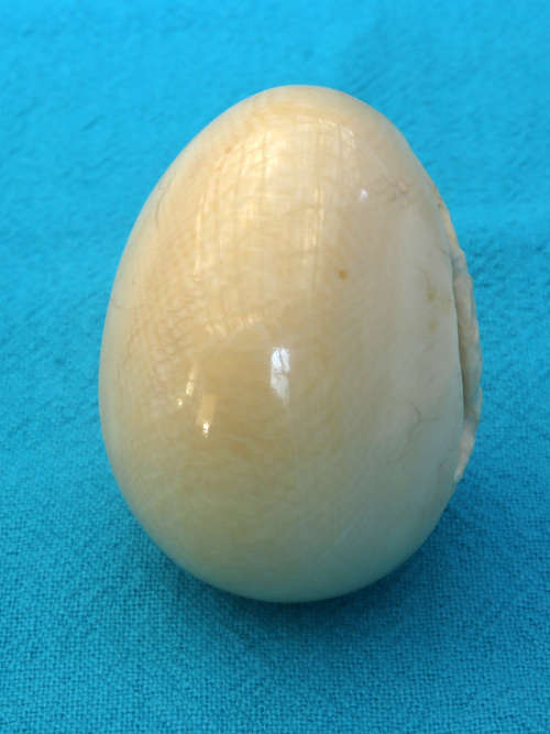 vintage ivory carved egg  with elephant