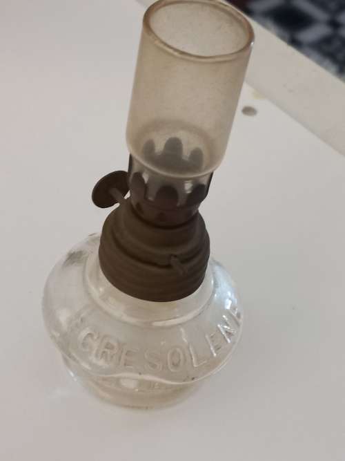 small antique kerosene lamp and glass holder