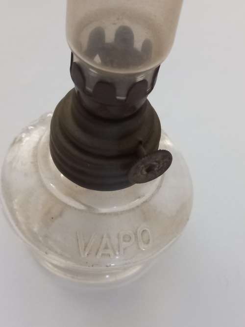 small antique kerosene lamp and glass holder