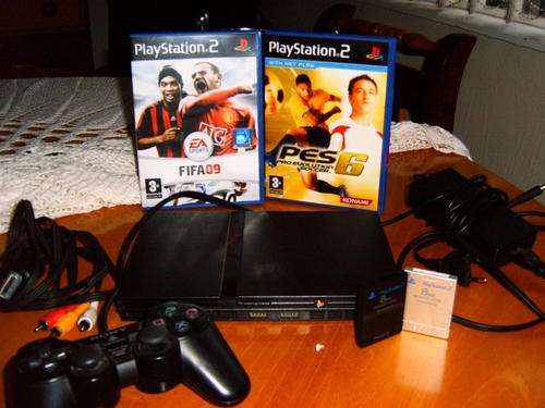 PS2 Console with memory and games