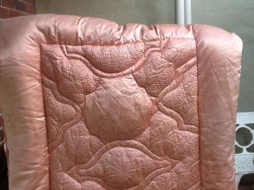 A Lovely Vintage Pink Feather Eiderdown for a Single Bed.