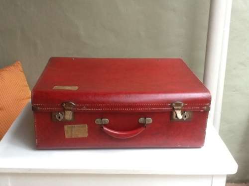 A Vintage Red Suitcase.