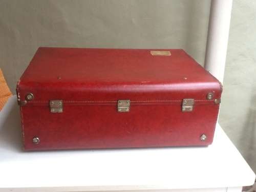 A Vintage Red Suitcase.