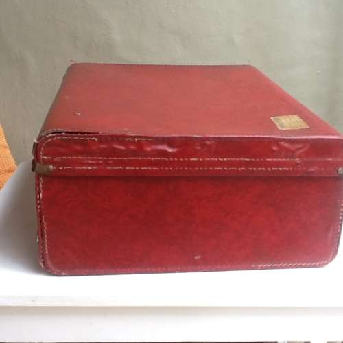 A Vintage Red Suitcase.