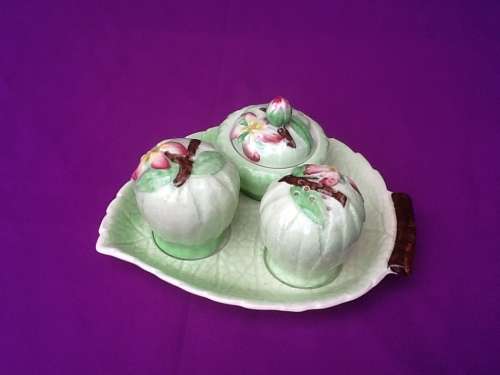 A Carltonware Salt, Pepper and Mustard Set in Green with Stand.