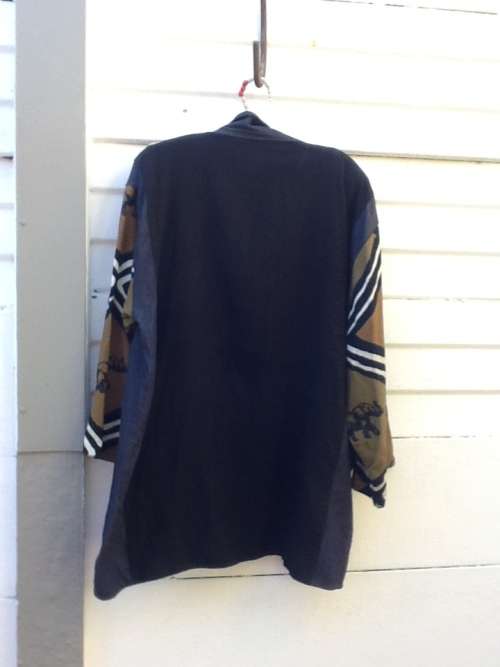 A Large Shirt/Jacket in the African Scene.  Size XL Meetu Magic.