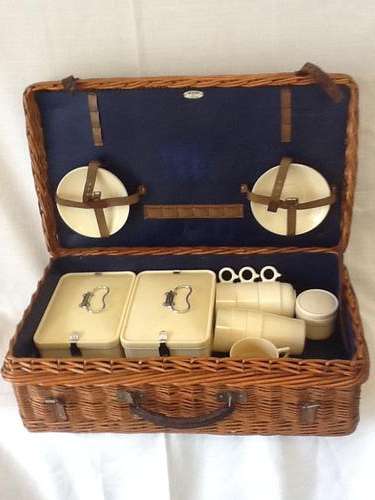 A Vintage Wicker Box with Utensils.