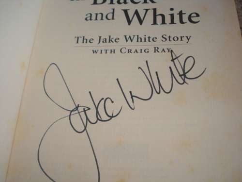TWO SPORTS MEMORABILIA BOOKS SIGNED BY JAKE WHITE AND MICHAEL MARNEWICK