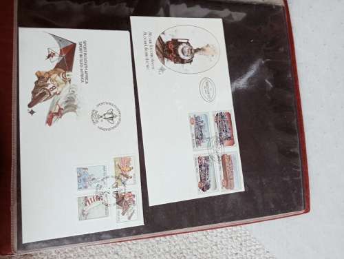 TWO FDC ALBUMS WITH QUALITY PLASTIC POCKETS MANY MANY FDC RSA AND BOP.