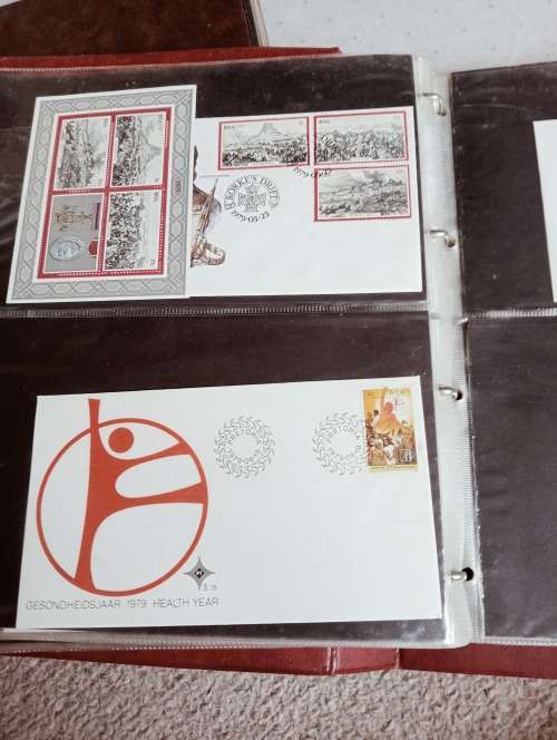 TWO FDC ALBUMS WITH QUALITY PLASTIC POCKETS MANY MANY FDC RSA AND BOP.