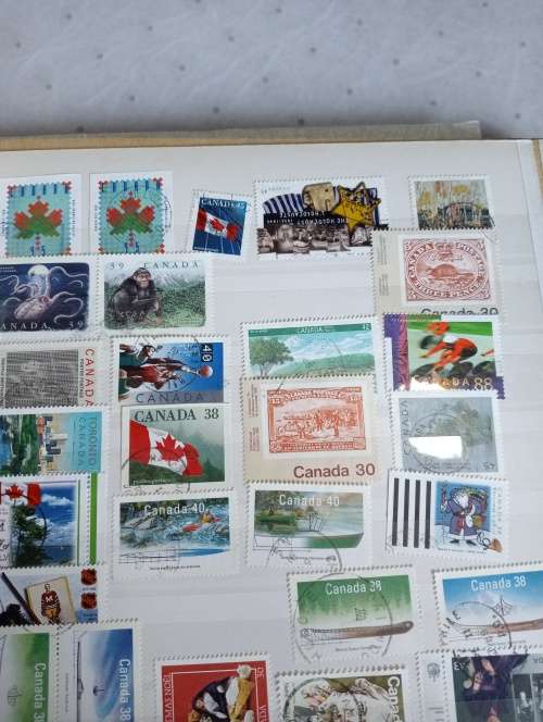 USA AND CANADA IN STOCK BOOK-A LITTLE MESSY AND SOME STUCK