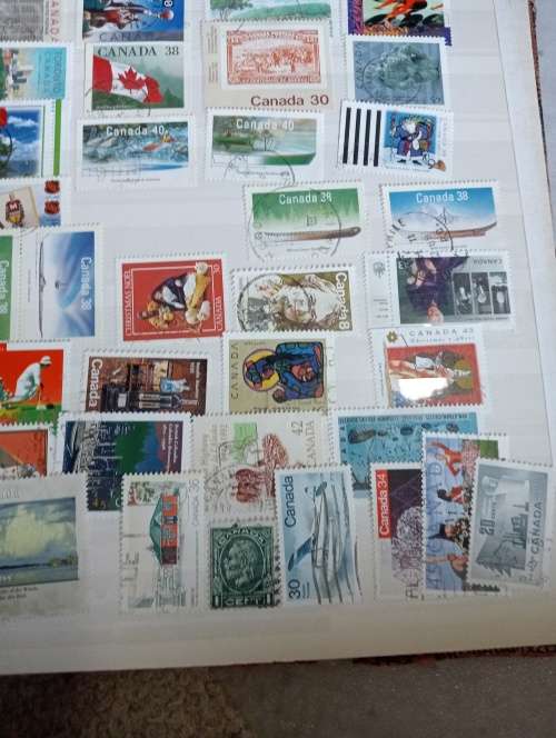 USA AND CANADA IN STOCK BOOK-A LITTLE MESSY AND SOME STUCK