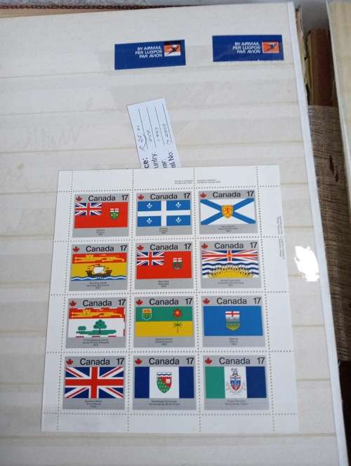 USA AND CANADA IN STOCK BOOK-A LITTLE MESSY AND SOME STUCK