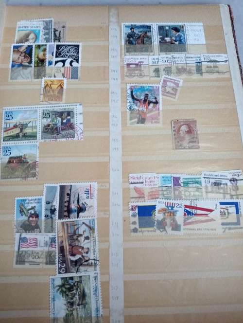 USA AND CANADA IN STOCK BOOK-A LITTLE MESSY AND SOME STUCK