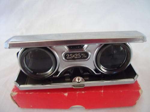 A FOLDING OPERA GLASS IN VERY GOOD CONDITION