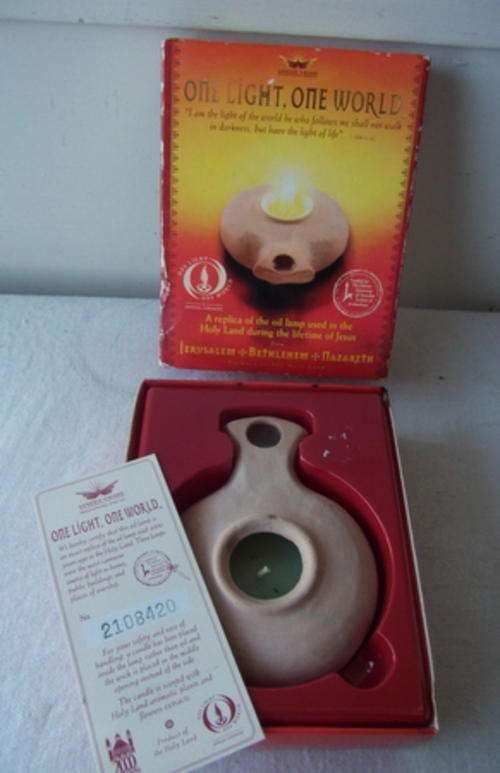 A RELICA OF THE OIL LAMP USED IN THE HOLY LAND DURING THE LIFETIME OF JESUS -