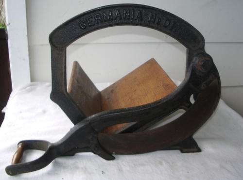 WROUGHT IRON GERMANIA BREAD CUTTER THAT NEEDS A WELD