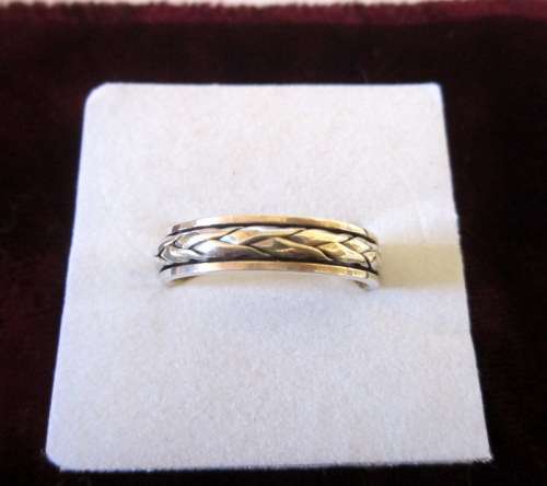 Sterling silver ring with plaid detail.