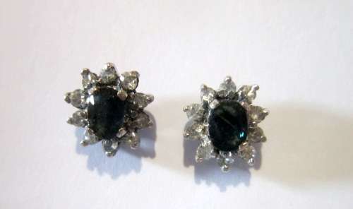 Blue and white sapphires set in a sterling silver studs. 10 mm. Hand crafted claw settings