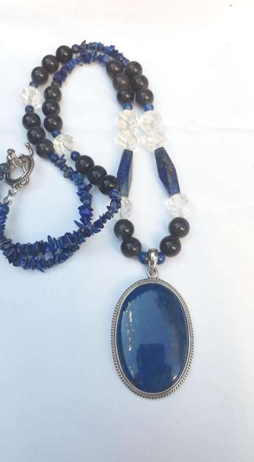Beautiful Lapis Lazuli and sterling silver pendant on a lovely string of beads.