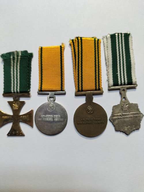 Miniature Correctional Service medals, documentation book and name badge