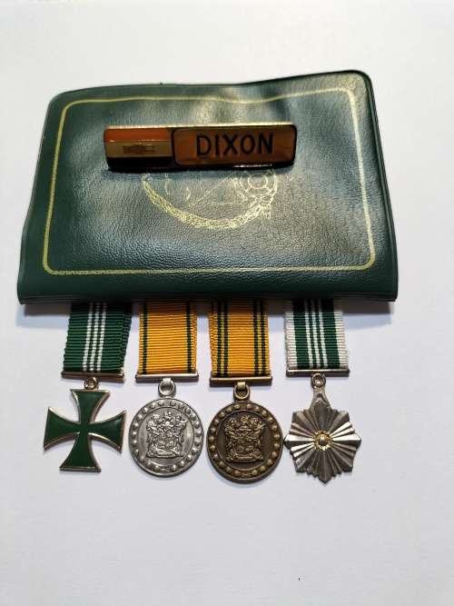 Miniature Correctional Service medals, documentation book and name badge