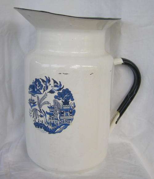 BLUE AND BLACK ENAMEL PITCHER WITH WILLOW PATTERN TRANSFER